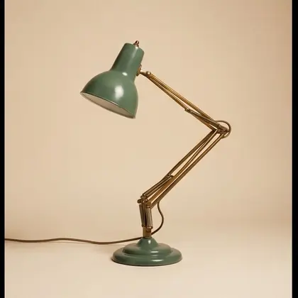 Brass and sage enamel articulated desk lamp, rotated 270 degrees.